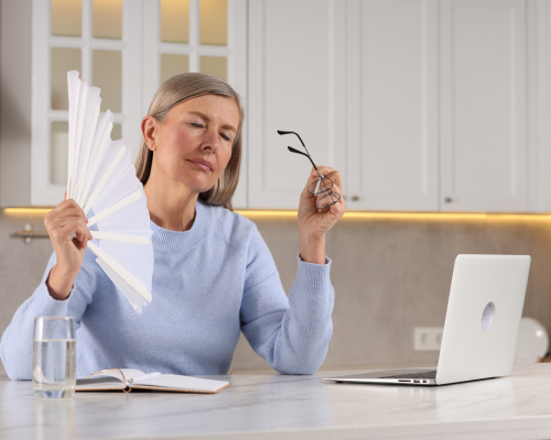 Woman going through a menopause hotflash