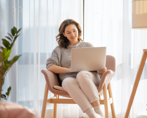Woman sitting with her laptop open