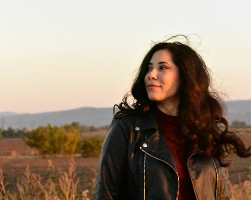 Woman outside looking into the distance