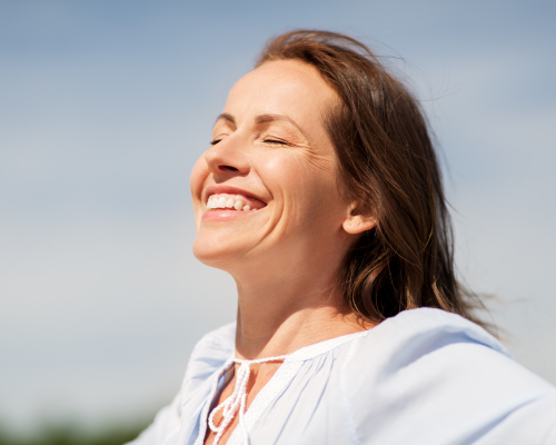 Woman outside smiling